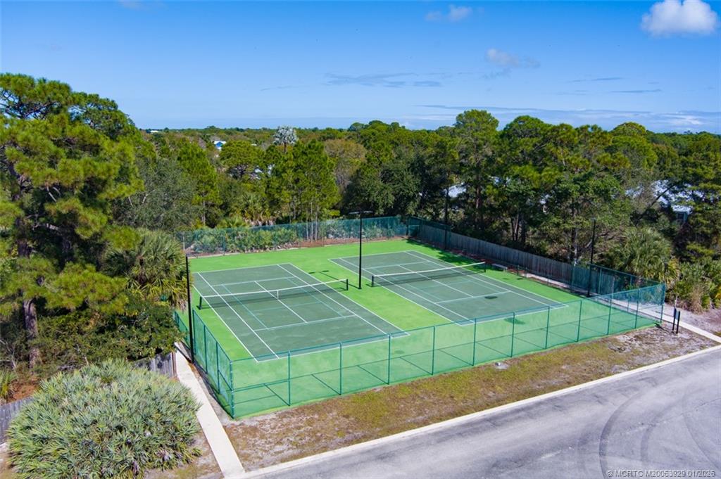 1976 Southwest Oak Ridge Road Palm City, FL 34990 - Photo 55 of 65 a view of a tennis ground with large trees