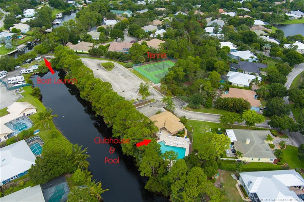 1976 Southwest Oak Ridge Road Palm City, FL 34990 - Photo 58 of 65 an aerial view of a house with a yard