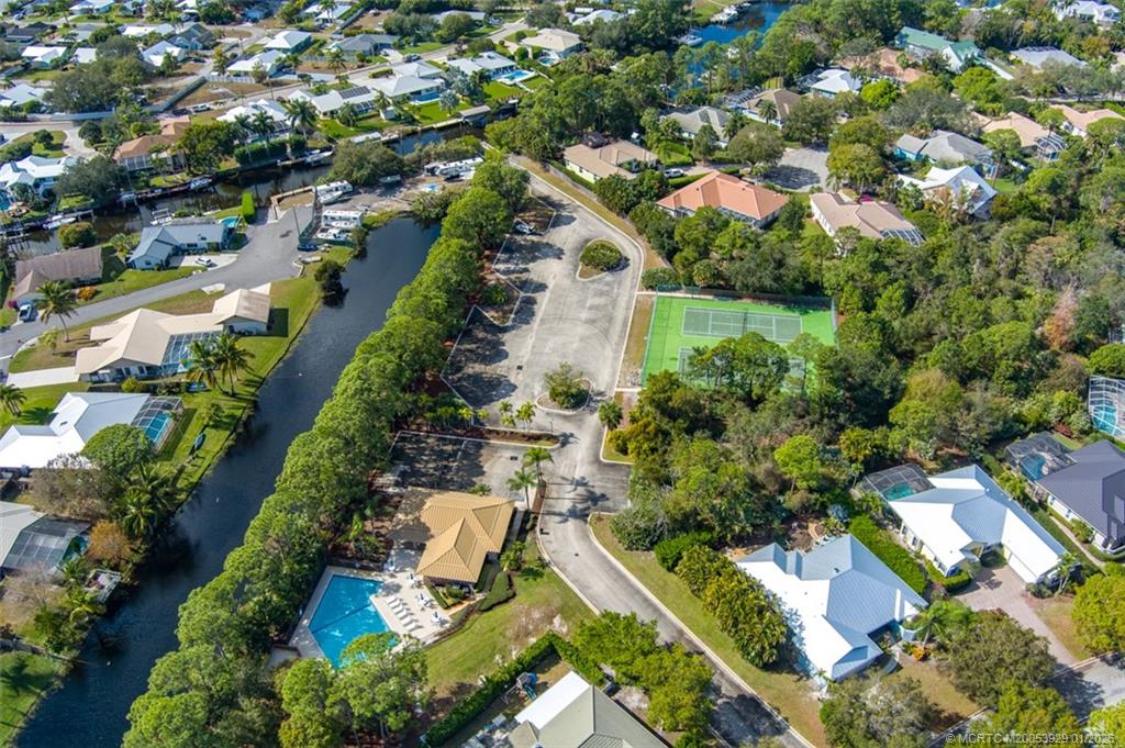 1976 Southwest Oak Ridge Road Palm City, FL 34990 - Photo 63 of 65 an aerial view of residential houses with outdoor space
