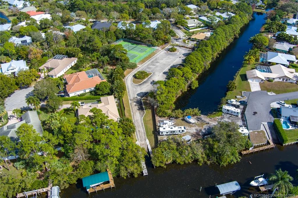 1976 Southwest Oak Ridge Road Palm City, FL 34990 - Photo 65 of 65 an aerial view of residential house with yard and swimming pool