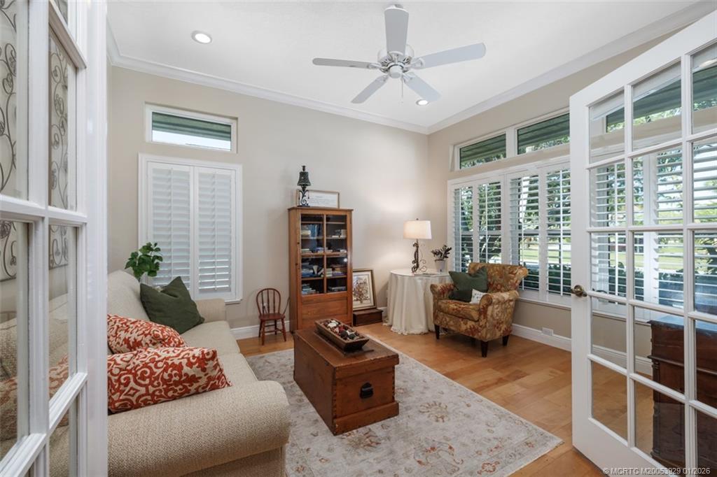 1976 Southwest Oak Ridge Road Palm City, FL 34990 - Photo 9 of 65 a living room with furniture and a large window