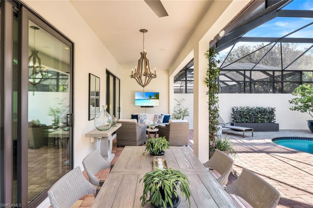 6573 Roma Way Naples, FL 34113 - Photo 30 of 49 View of patio featuring an outdoor living space and a lanai