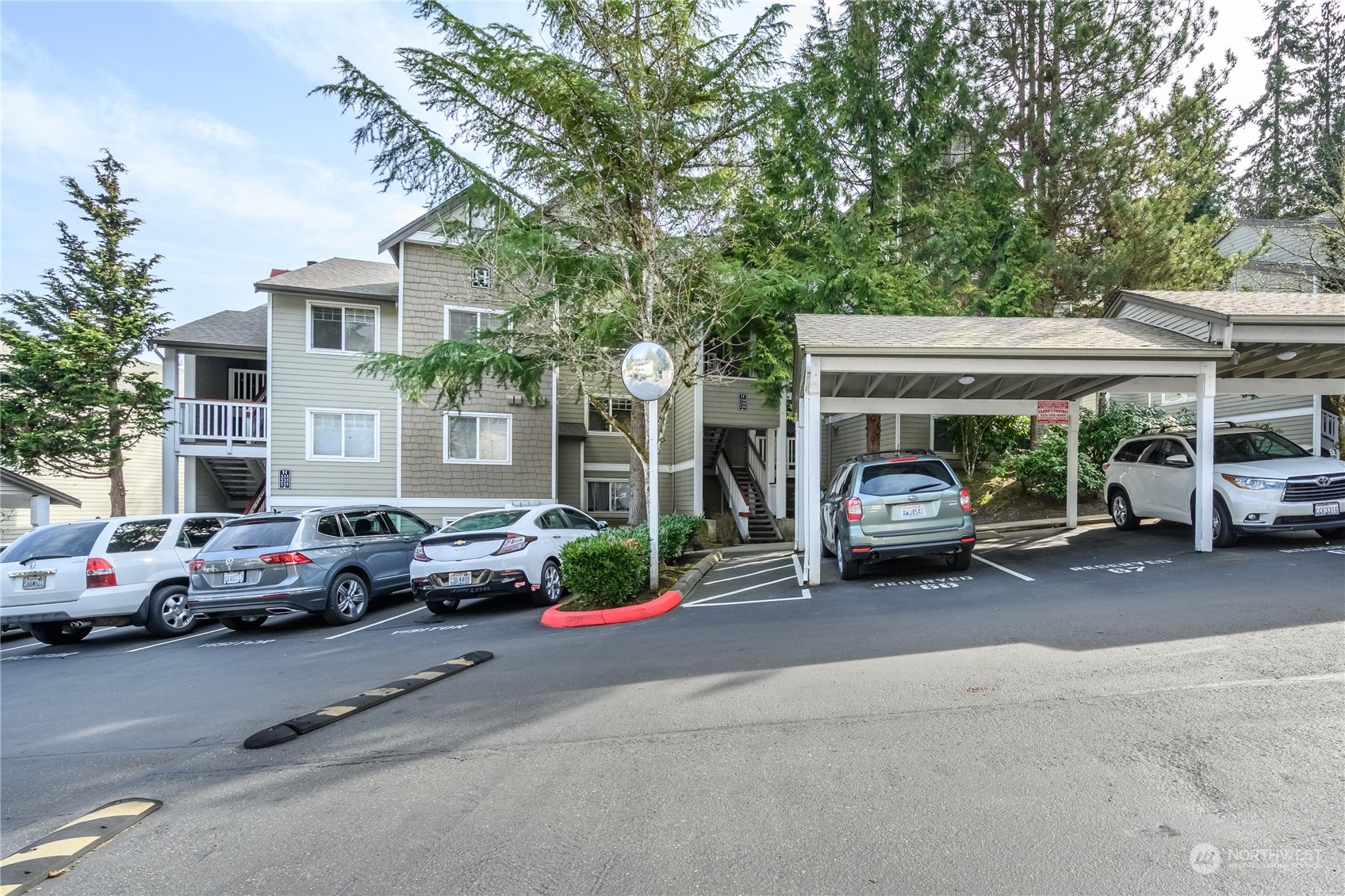 18501 Southeast Newport Way, Unit H236 Issaquah, WA 98027 - Photo 1 of 25 a view of a cars parked in front of a house