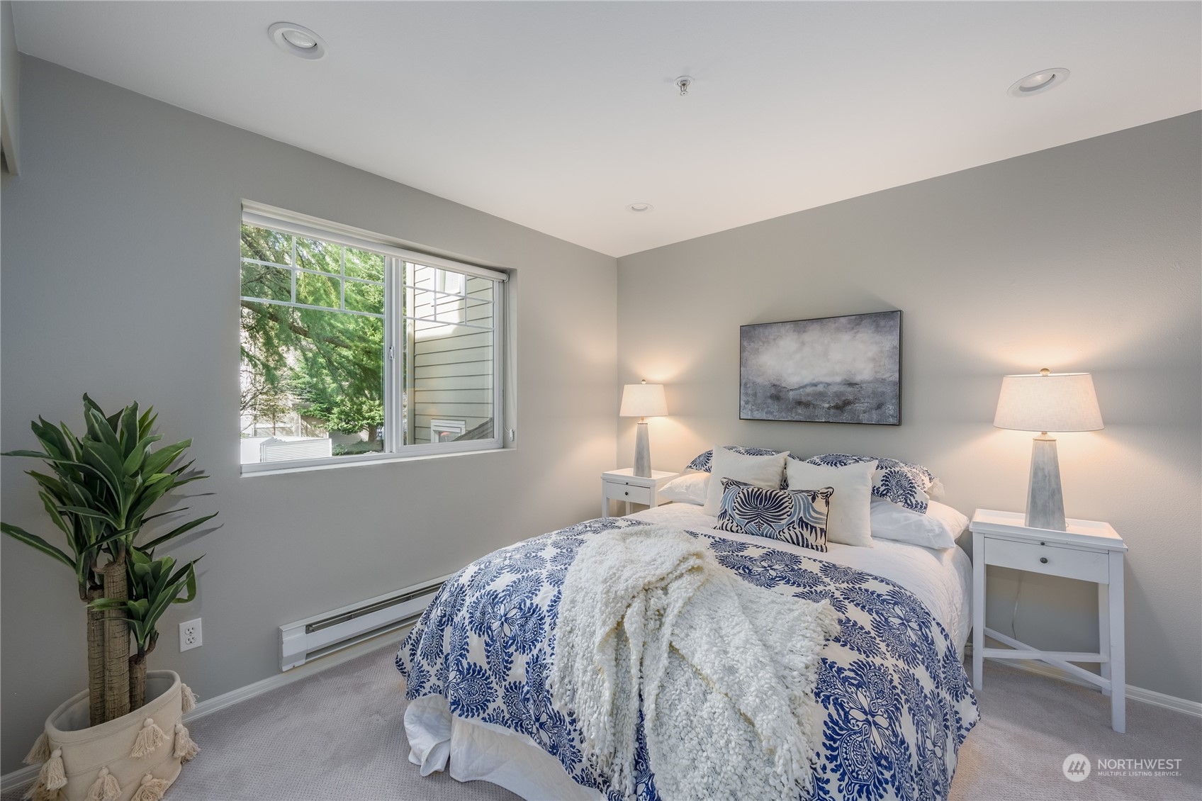 18501 Southeast Newport Way, Unit H236 Issaquah, WA 98027 - Photo 15 of 25 a bedroom with a bed and a potted plant