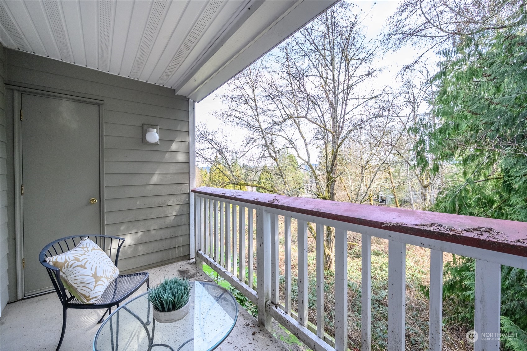 18501 Southeast Newport Way, Unit H236 Issaquah, WA 98027 - Photo 20 of 25 a view of a balcony with furniture