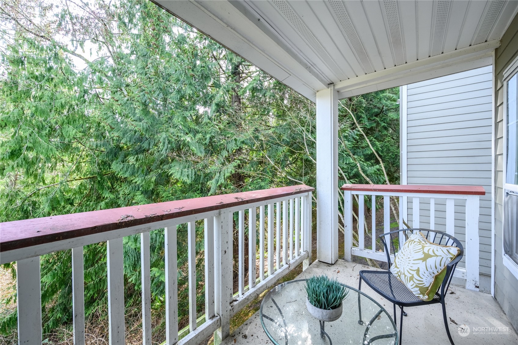 18501 Southeast Newport Way, Unit H236 Issaquah, WA 98027 - Photo 21 of 25 a view of a balcony with chairs