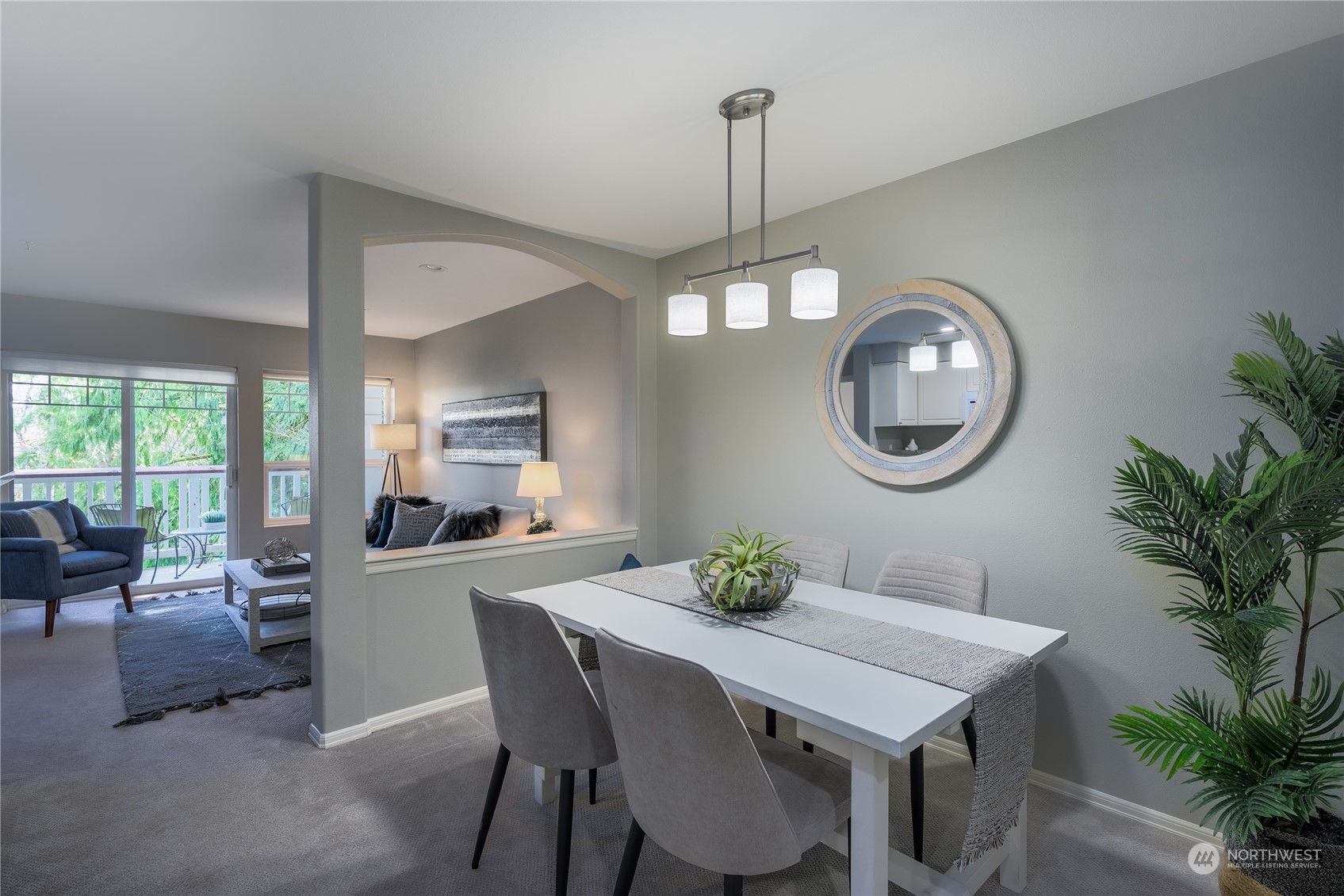 18501 Southeast Newport Way, Unit H236 Issaquah, WA 98027 - Photo 6 of 25 a view of a dining room with furniture window and wooden floor
