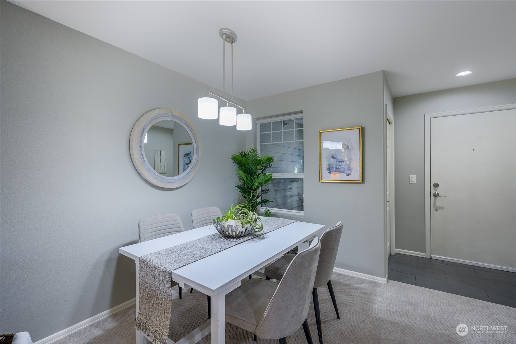18501 Southeast Newport Way, Unit H236 Issaquah, WA 98027 - Photo 7 of 25 a view of a dining room with a table and chairs