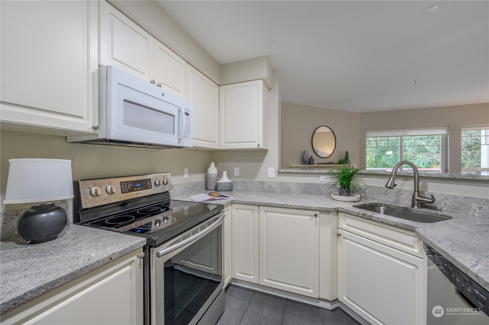 18501 Southeast Newport Way, Unit H236 Issaquah, WA 98027 - Photo 9 of 25 a kitchen with appliances cabinets and a sink