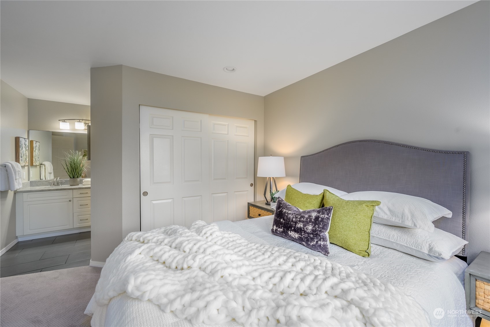 18501 Southeast Newport Way, Unit H236 Issaquah, WA 98027 - Photo 10 of 25 a bedroom with a bed and dresser
