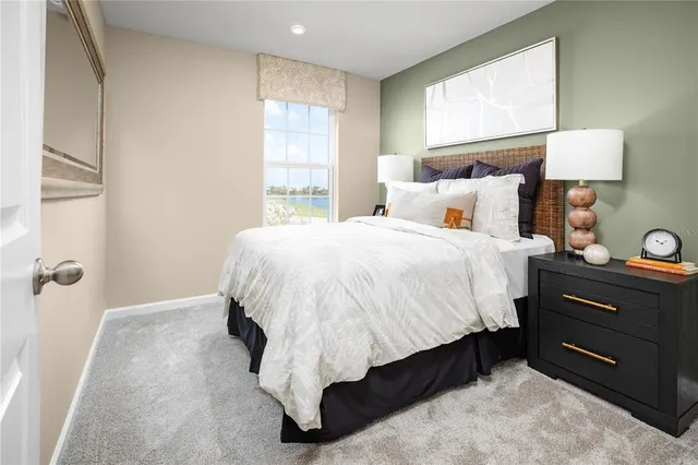 a bedroom with a bed and window