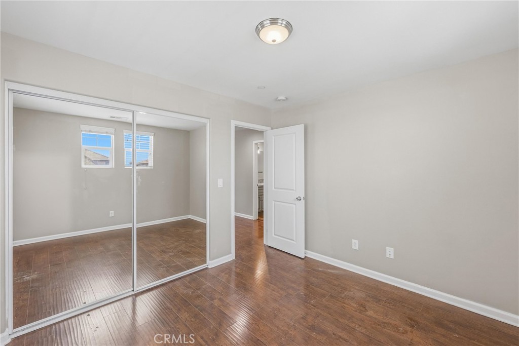 956 West Tibbot Street Rialto, CA 92377 - Photo 37 of 37 an empty room with wooden floor and windows