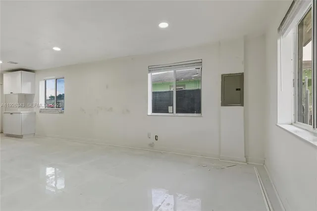 a view of an empty room with a window