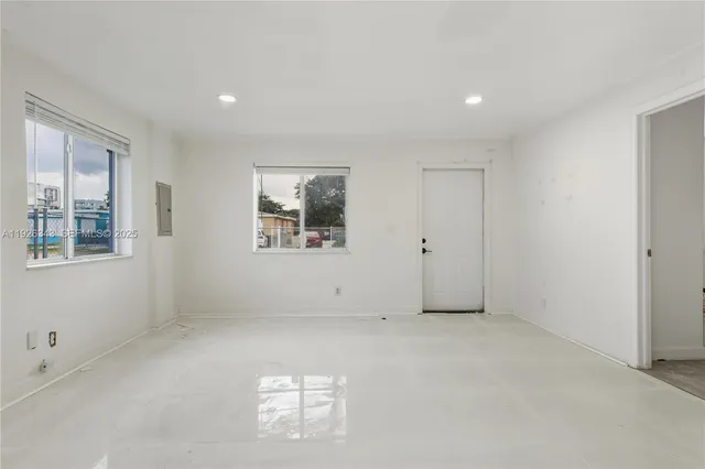 an empty room with windows