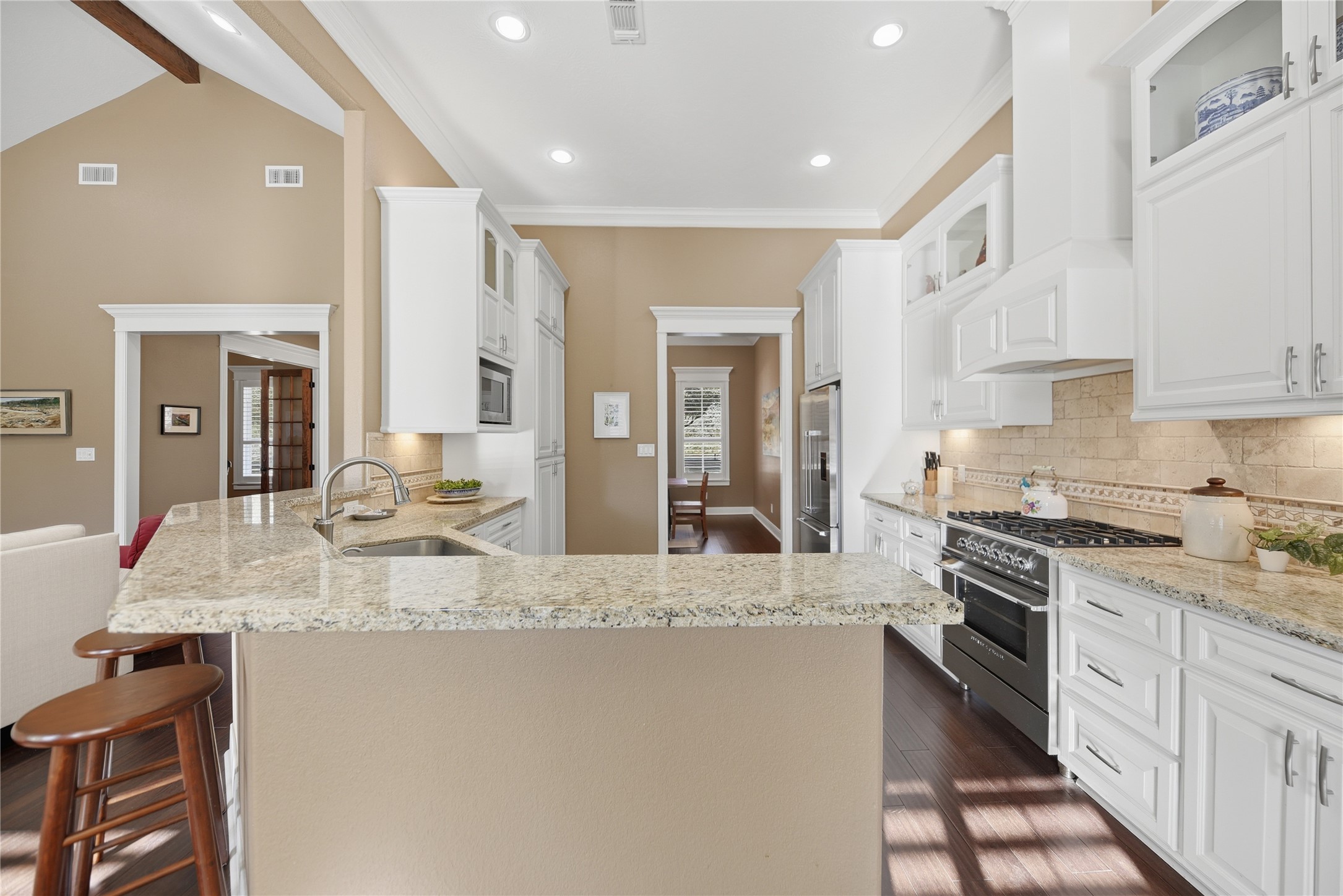 110 Windy Acres Road Brenham, TX 77833 - Photo 14 of 38 a large kitchen with granite countertop a large counter top appliances and cabinets