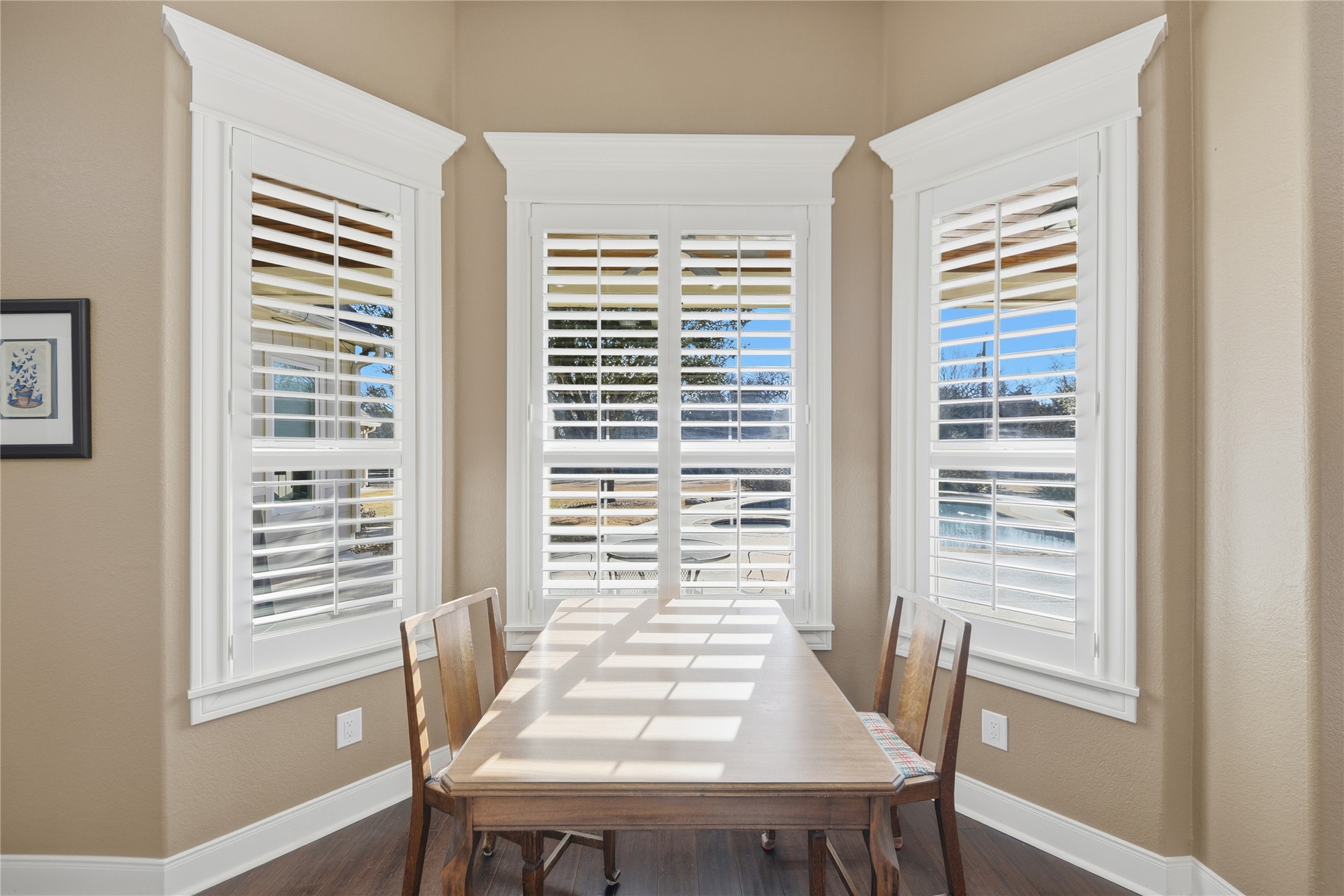 110 Windy Acres Road Brenham, TX 77833 - Photo 16 of 38 a view of a dining room with furniture and wooden floor