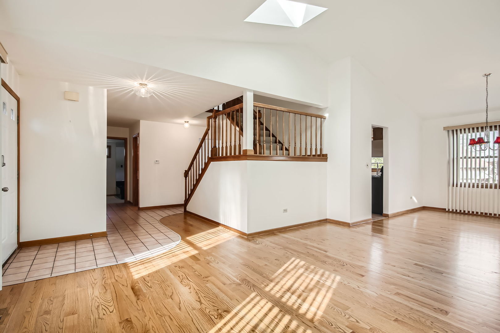 4665 Olmstead Drive Hoffman Estates, IL 60192 - Photo 21 of 42 a view of an empty room with wooden floor and a window