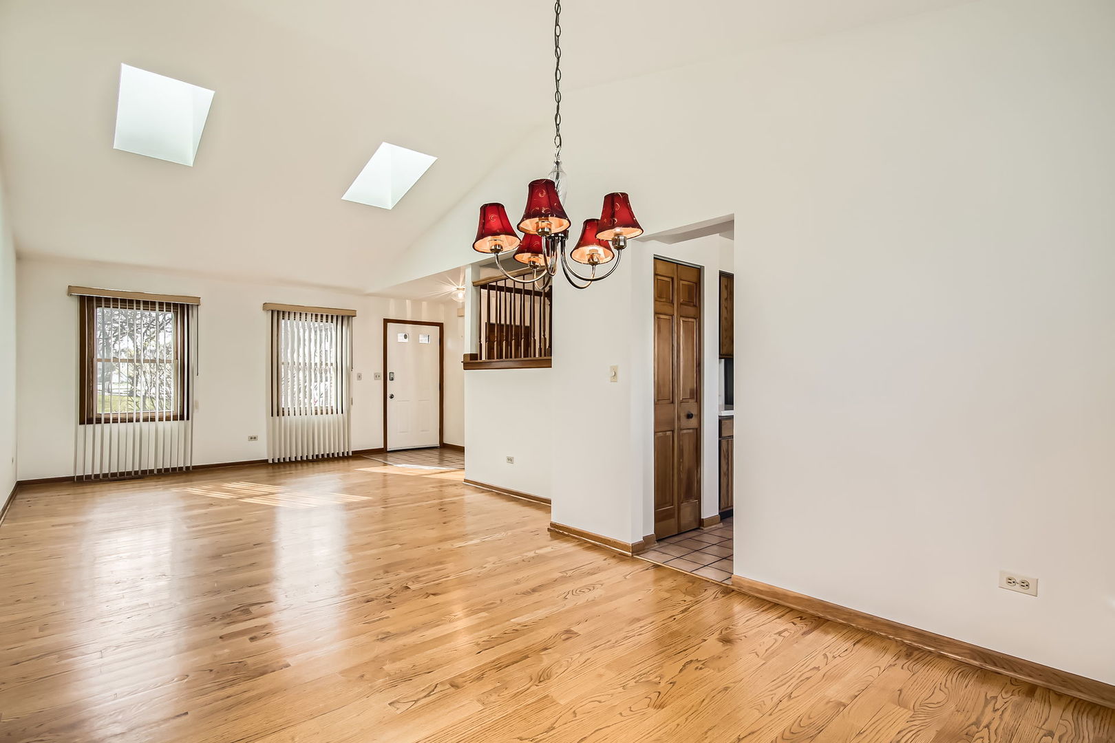 4665 Olmstead Drive Hoffman Estates, IL 60192 - Photo 23 of 42 a view of a livingroom with wooden floor and window