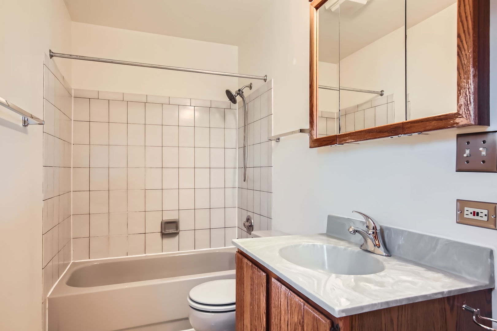 4665 Olmstead Drive Hoffman Estates, IL 60192 - Photo 8 of 42 a bathroom with a sink vanity granite toilet tub and shower