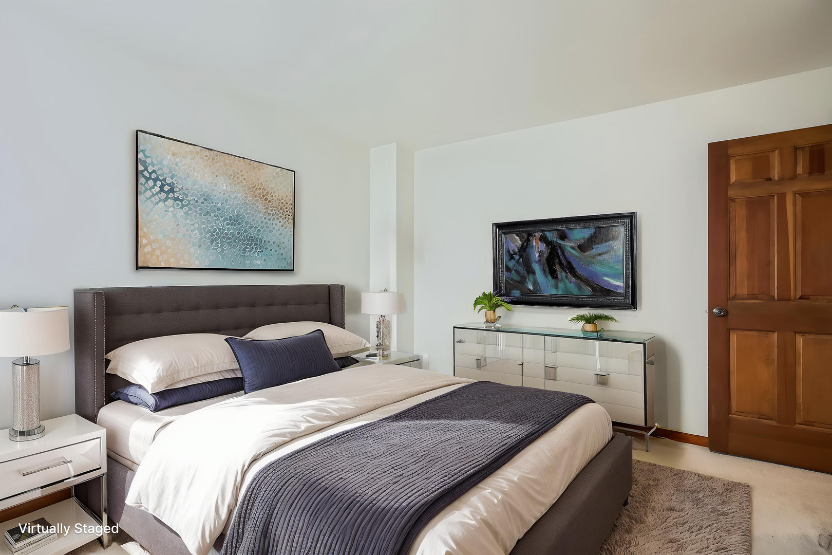 4665 Olmstead Drive Hoffman Estates, IL 60192 - Photo 9 of 42 a bedroom with a bed and a flat screen tv