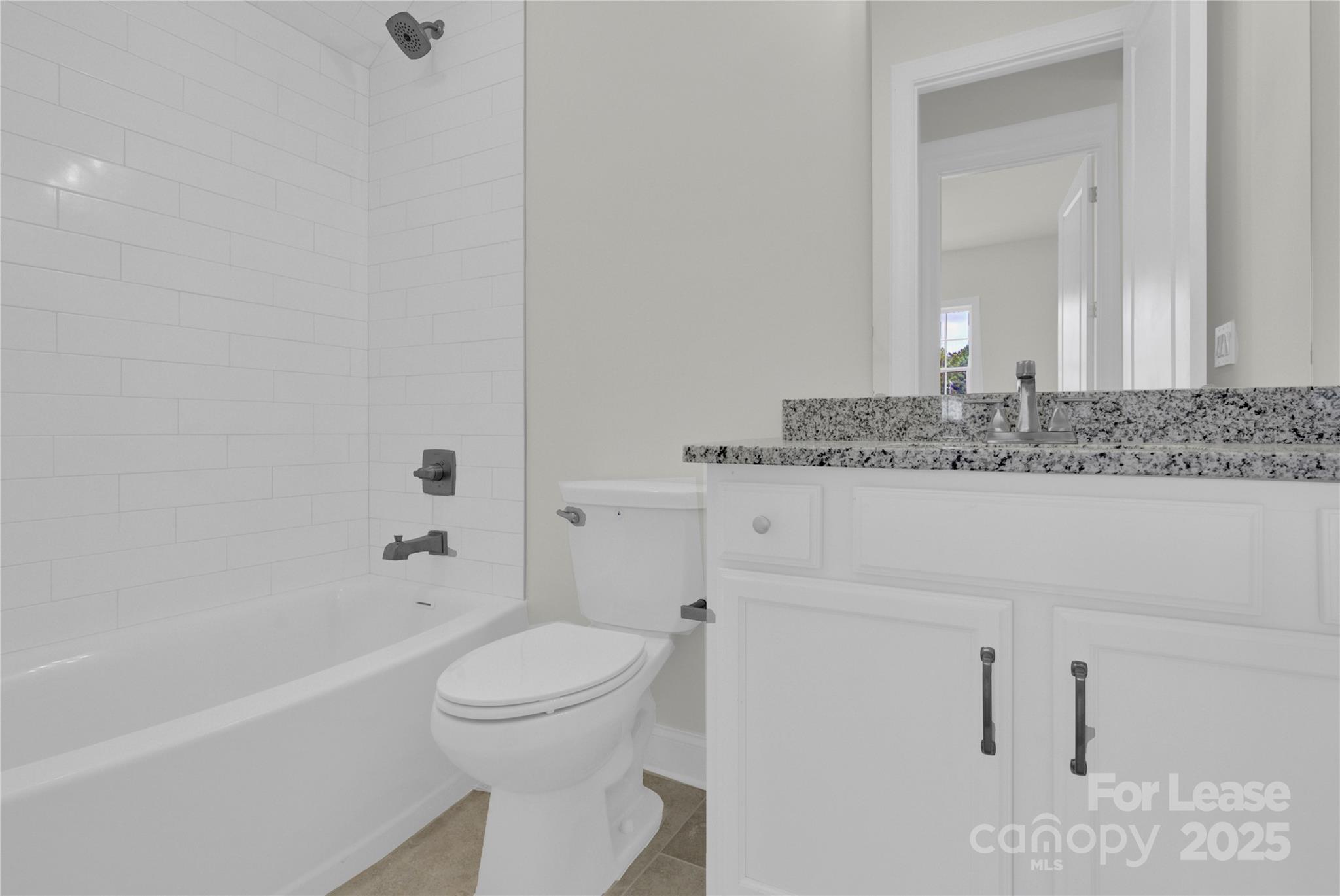 4715 Anise Circle, Unit 40 Sherrills Ford, NC 28673 - Photo 15 of 20 a bathroom with a granite countertop sink a toilet and bathtub