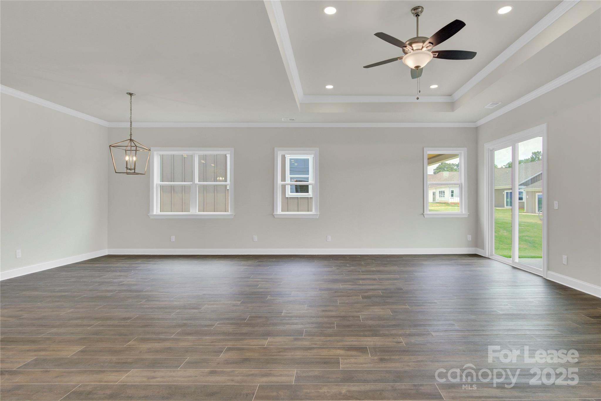 4715 Anise Circle, Unit 40 Sherrills Ford, NC 28673 - Photo 7 of 20 an empty room with wooden floor and windows