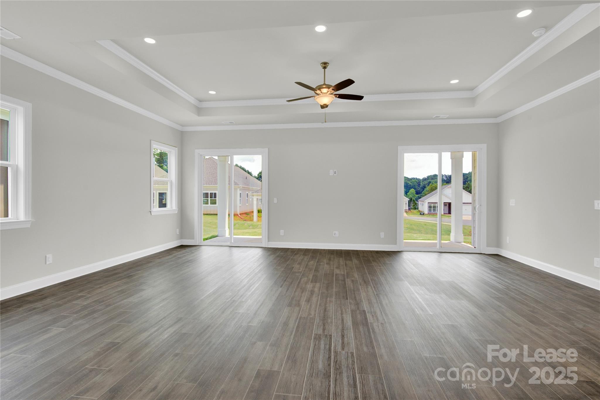 4715 Anise Circle, Unit 40 Sherrills Ford, NC 28673 - Photo 8 of 20 a view of an empty room with a window and wooden floor