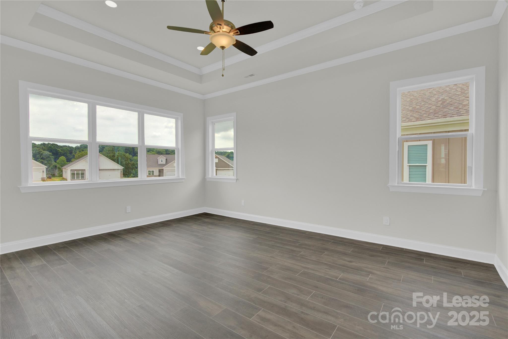 4715 Anise Circle, Unit 40 Sherrills Ford, NC 28673 - Photo 10 of 20 a view of an empty room with a window and wooden floor