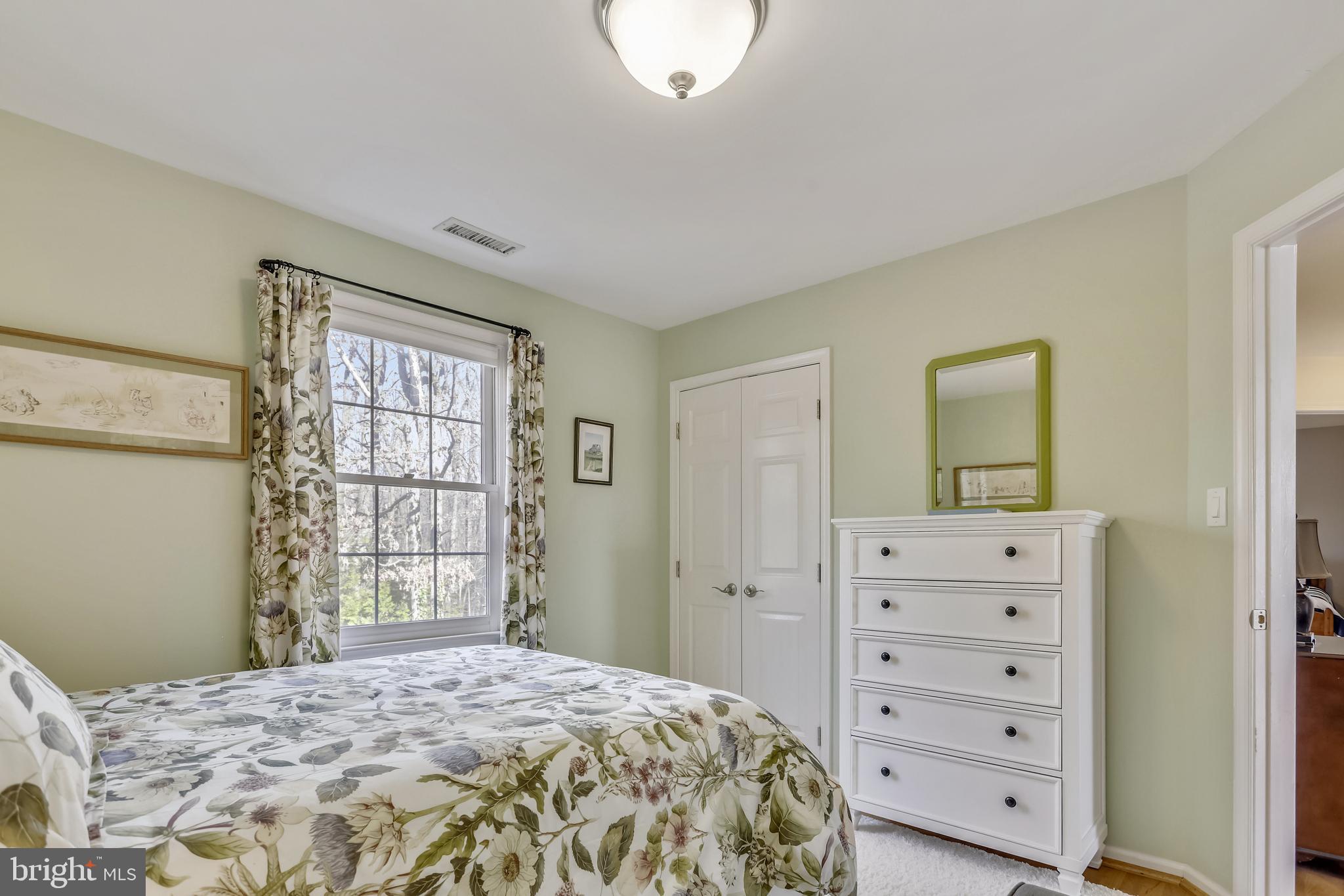 10783 Kinloch Road Silver Spring, MD 20903 - Photo 17 of 43 a bedroom with a bed and a window