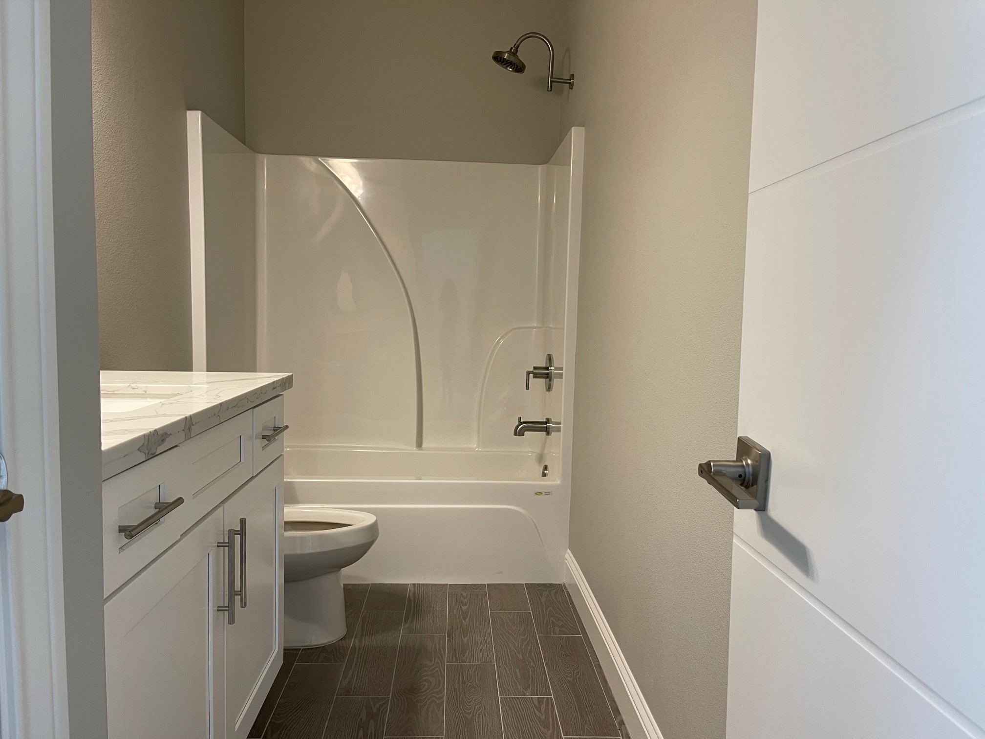 10440 Dominion Ranch Drive Port Arthur, TX 77640 - Photo 20 of 22 a bathroom with a granite countertop sink toilet and shower