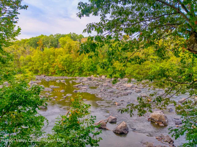 a kitchen with stainless steel appliances granite countertop a sink and a counter space