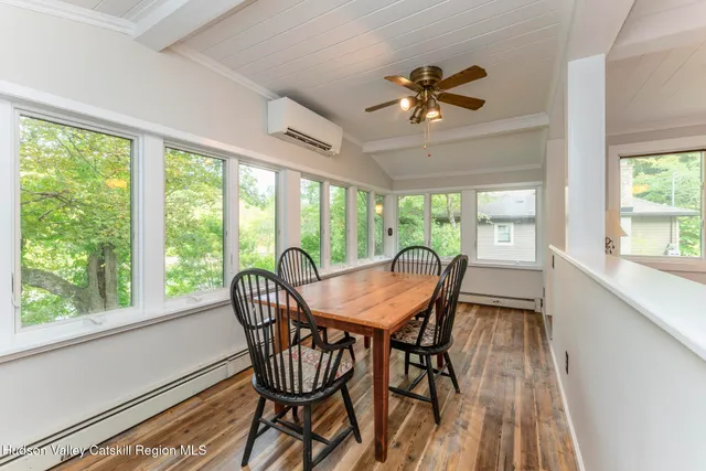 a view of a house with a yard patio and fire pit