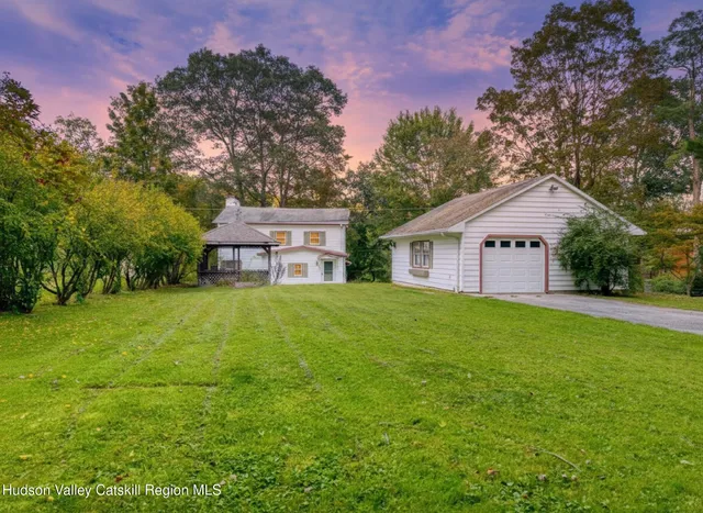 a view of a park with large trees
