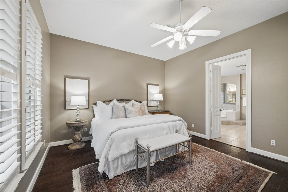 14530 Millhouse Road Pinehurst, TX 77362 - Photo 19 of 46 Alternate view of the primary bedroom highlighting access to the ensuite bathroom.