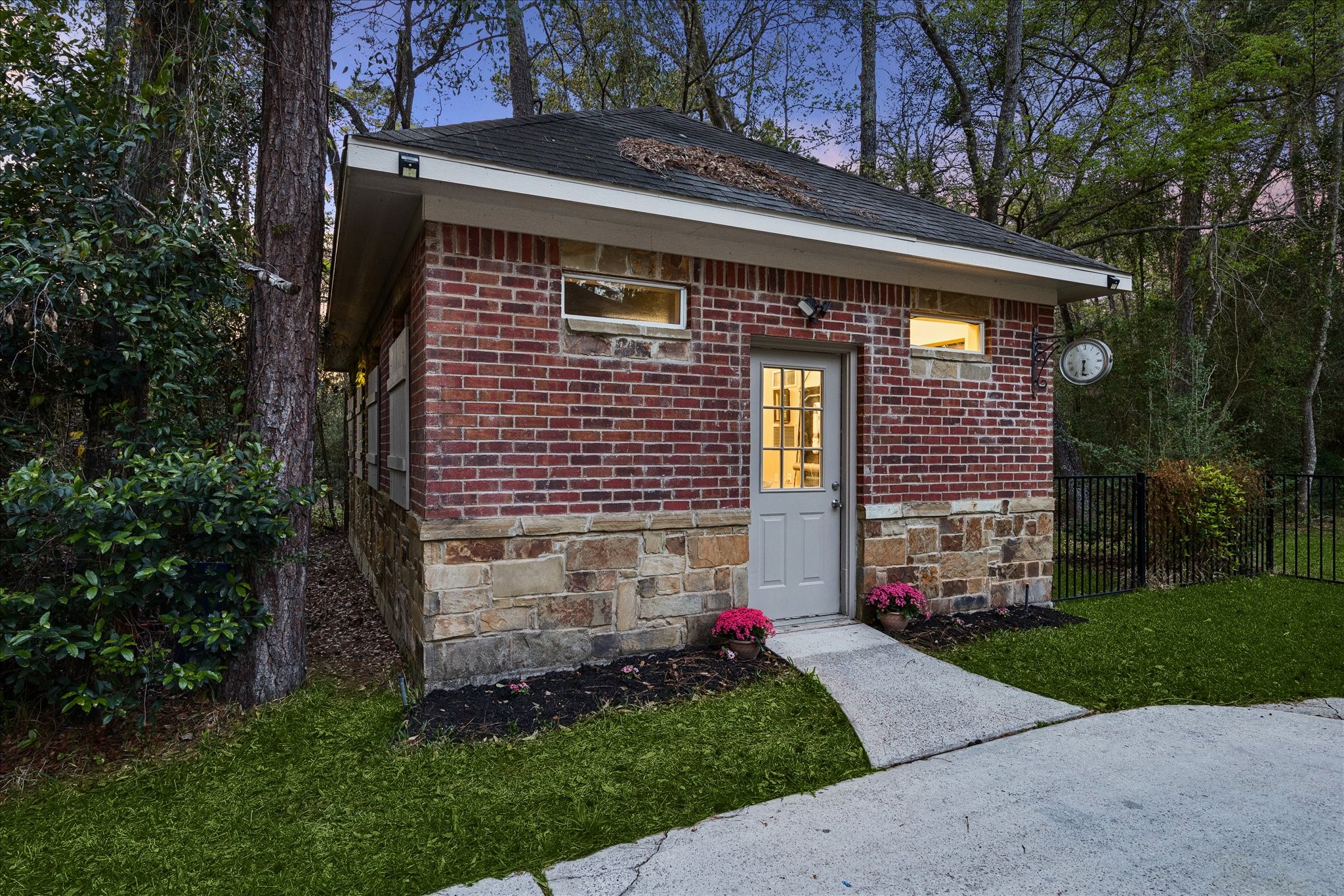 14530 Millhouse Road Pinehurst, TX 77362 - Photo 36 of 43 Climate-controlled workshop with dedicated golf cart garage—versatile space ideal for hobbies, storage, or a private retreat.