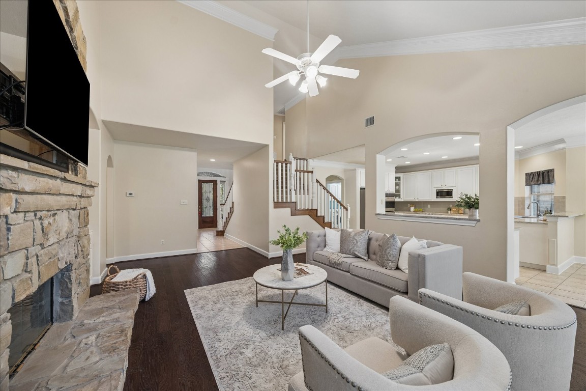 14530 Millhouse Road Pinehurst, TX 77362 - Photo 10 of 46 Open-concept layout connecting the living area to the kitchen and breakfast room, creating a seamless flow ideal for everyday living and entertaining.