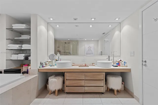 a bathroom with a sink double vanity and a toilet