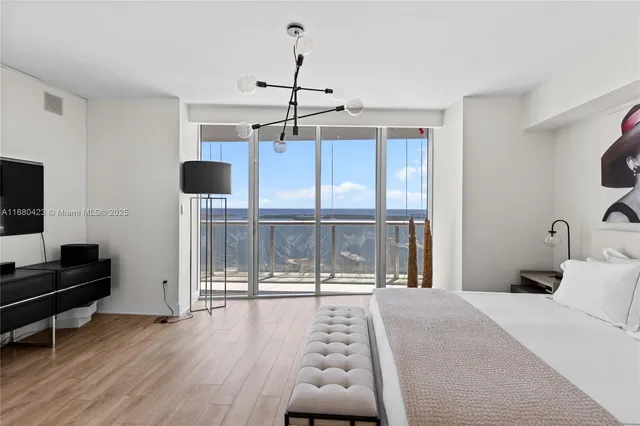 a bedroom with furniture and a window