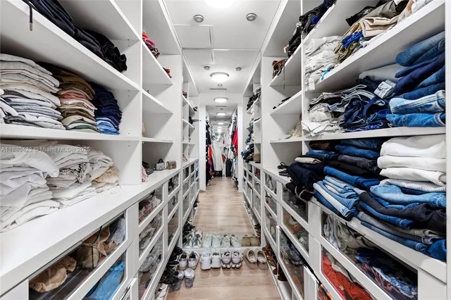 walk in a hallway with lots of different colored cloths