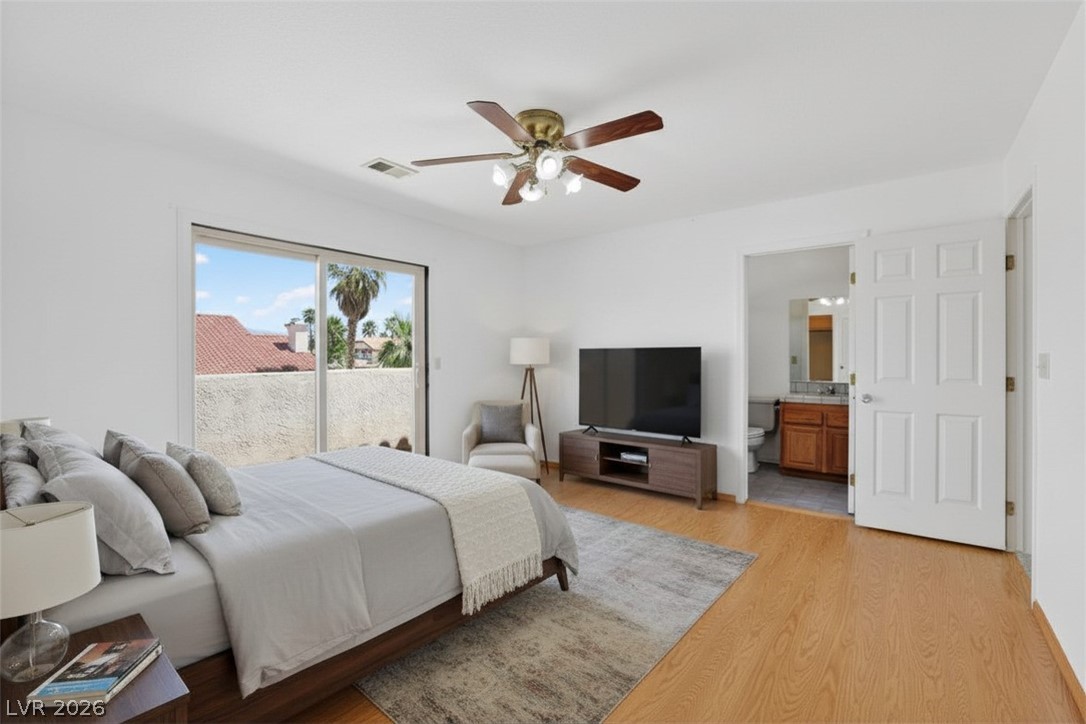 3698 Laughlin Boulevard Laughlin, NV 89029 - Photo 34 of 49 A restful primary bedroom retreat with private balcony access and an adjacent bathroom.