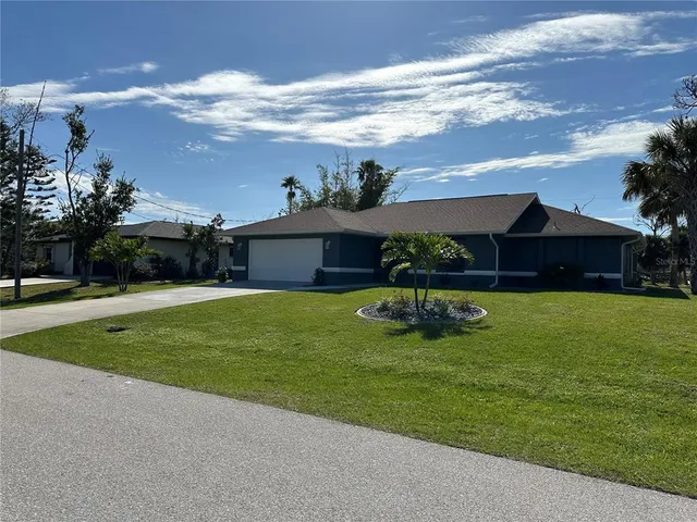 a house view with swimming pool and garden