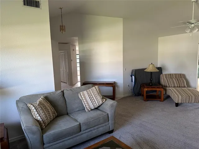 a living room with furniture and a couch