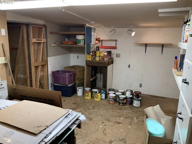 a living room with furniture a fireplace and gym equipment