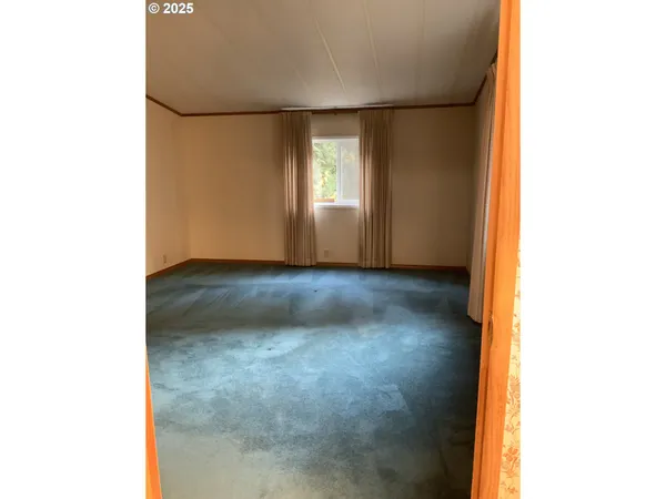 a view of an empty room with windows