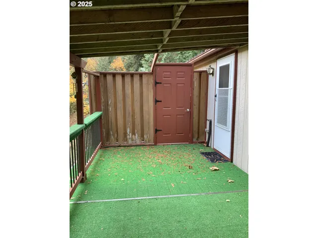 a view of a backyard of the house