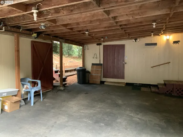a view of a room with wooden walls