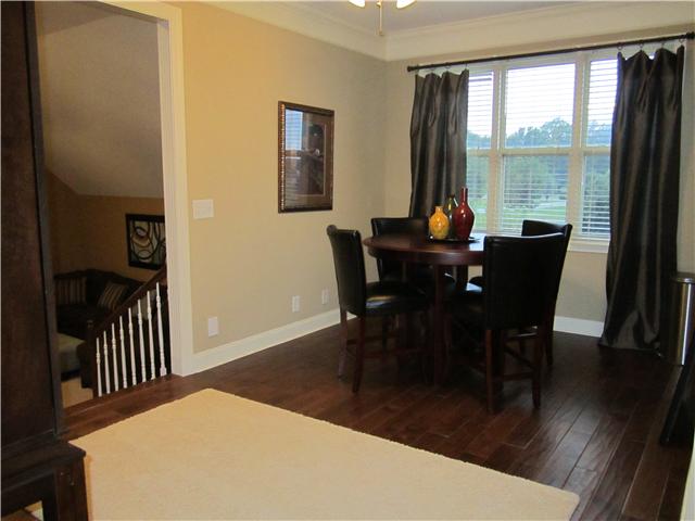 4799 Sango Road Clarksville, TN 37043 - Photo 14 of 20 a view of a dining room with furniture window and wooden floor