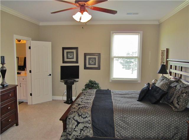 4799 Sango Road Clarksville, TN 37043 - Photo 20 of 20 a bedroom with a bed and a chandelier