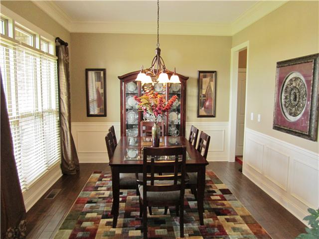 4799 Sango Road Clarksville, TN 37043 - Photo 8 of 20 a view of a dining room with furniture window and wooden floor
