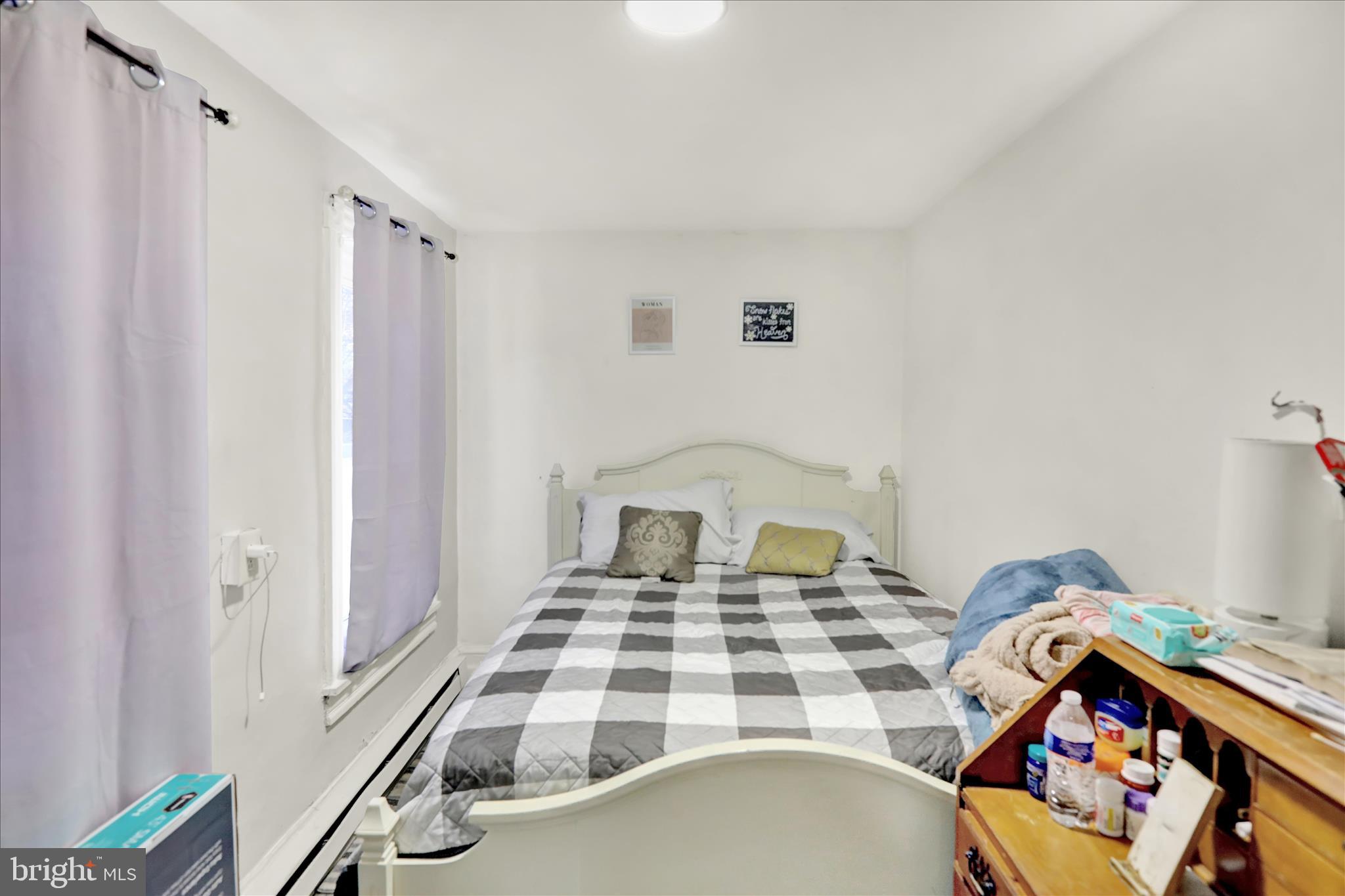 1328 Kenny Street Reading, PA 19602 - Photo 12 of 18 a bedroom with a bed and a dresser